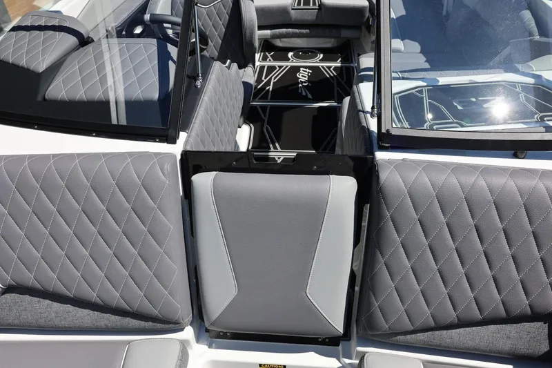Slide: The Image of 2026 Tigé Z3 boat interior with diamond-stitched gray upholstery and sleek design. - 57