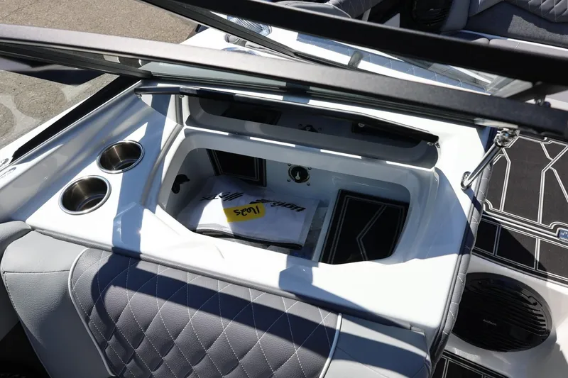 Slide: The Image of Interior of 2026 Tigé Z3 boat featuring cup holders and storage compartment. - 61
