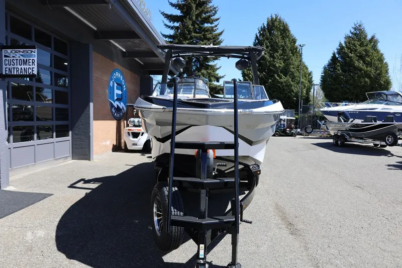 Slide: The Image of 2026 Tigé Z3 boat displayed at Bjornson Marine dealership. - 8