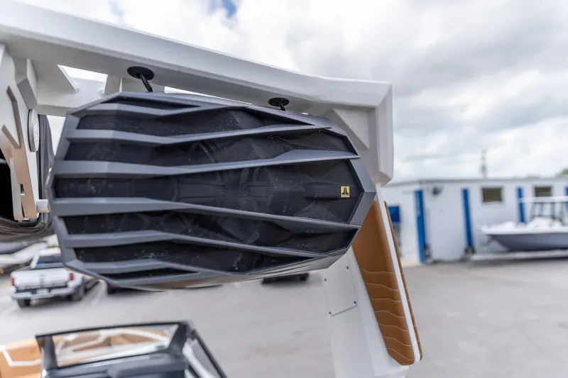 Slide: The Image of 2025 Nautique Super Air Nautique G23 boat speaker, close-up view, outdoor setting. - 13