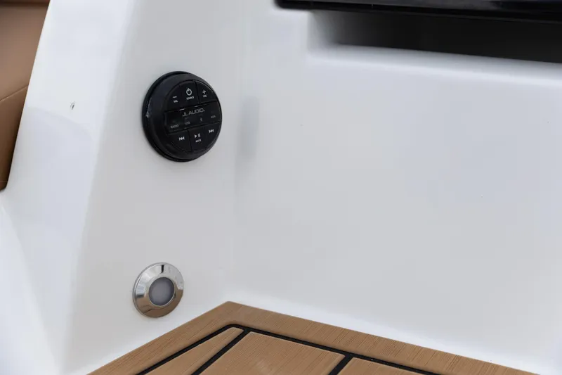 Slide: The Image of 2025 Nautique Super Air Nautique G23 audio control panel and deck detail. - 22