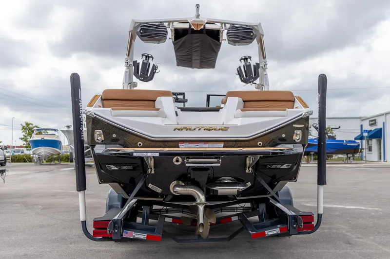 Slide: The Image of 2025 Nautique Super Air Nautique G23 boat rear view, showcasing sleek design and features. - 4