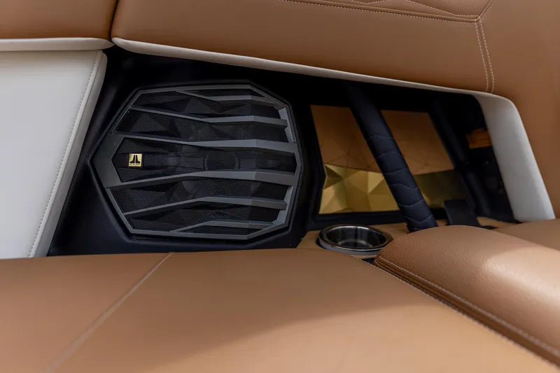 Slide: The Image of 2025 Nautique Super Air Nautique G23 interior speaker and cup holder detail. - 7