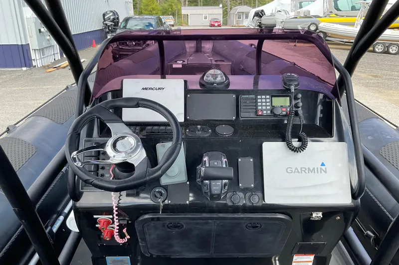 Slide: The Image of Control panel of a 2016 Ocean Marine Craft Amphibious boat with Garmin and Mercury equipment. - 12
