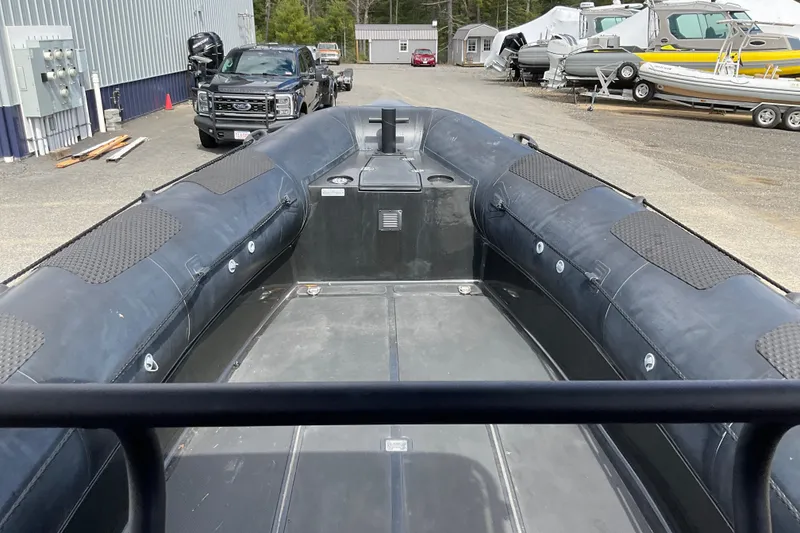 Slide: The Image of 2016 Ocean Marine Craft Amphibious boat, docked with vehicles and trailers in the background. - 13