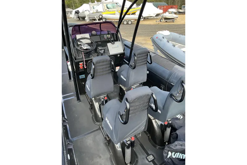 Slide: The Image of Interior of a 2016 Ocean Marine Craft Amphibious boat with seating and control panel. - 26