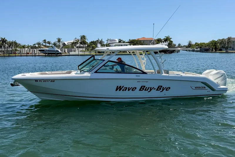 The Image of 2017 Boston Whaler 320 Vantage boat named "Wave Buy-Bye" on calm water. - 0