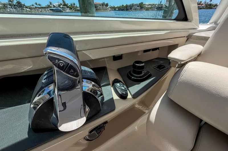 Slide: The Image of 2017 Boston Whaler 320 Vantage boat controls with throttle and joystick. - 11