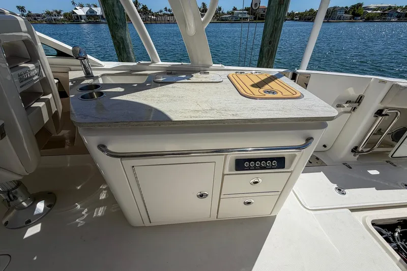 Slide: The Image of Boston Whaler 320 Vantage 2017 boat interior with kitchenette and water view. - 20