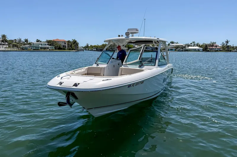 Slide: The Image of 2017 Boston Whaler 320 Vantage boat cruising on a sunny day. - 24