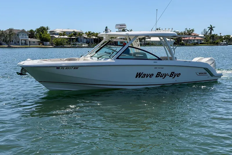 Slide: The Image of 2017 Boston Whaler 320 Vantage boat named "Wave Buy-Bye" on calm water. - 26