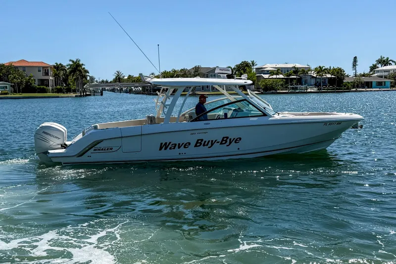 Slide: The Image of 2017 Boston Whaler 320 Vantage boat named "Wave Buy-Bye" cruising on a sunny day. - 29