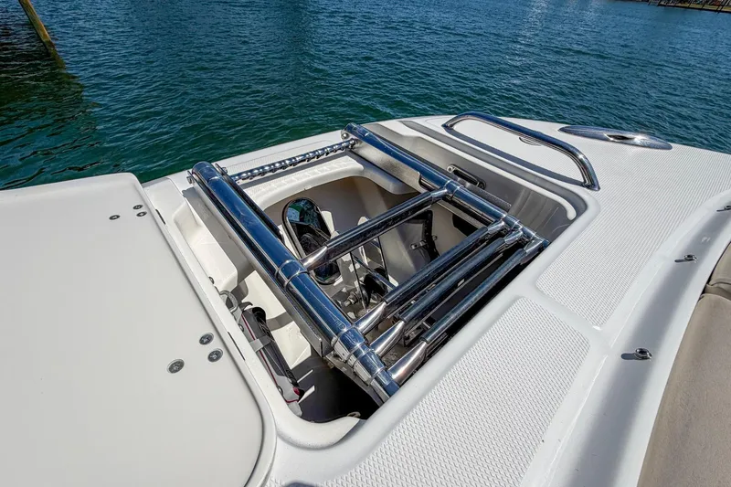 Slide: The Image of 2017 Boston Whaler 320 Vantage boat with open storage compartment and stainless steel fittings. - 4