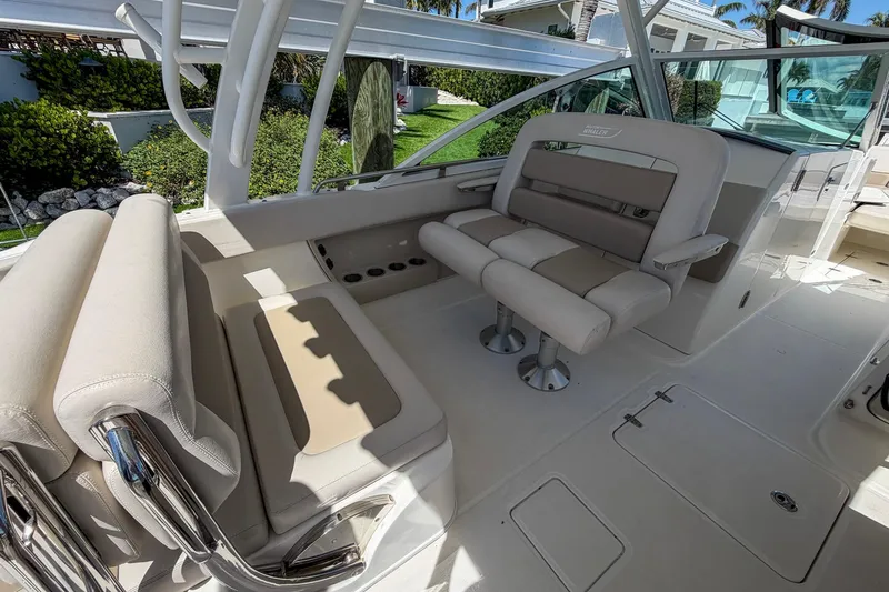 Slide: The Image of 2017 Boston Whaler 320 Vantage boat interior with beige seating and sleek design. - 7