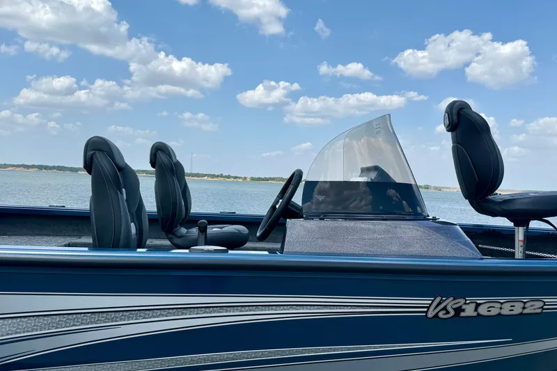 Slide: The Image of 2026 Ranger VS1682SC Angler boat on a lake under a blue sky. - 3