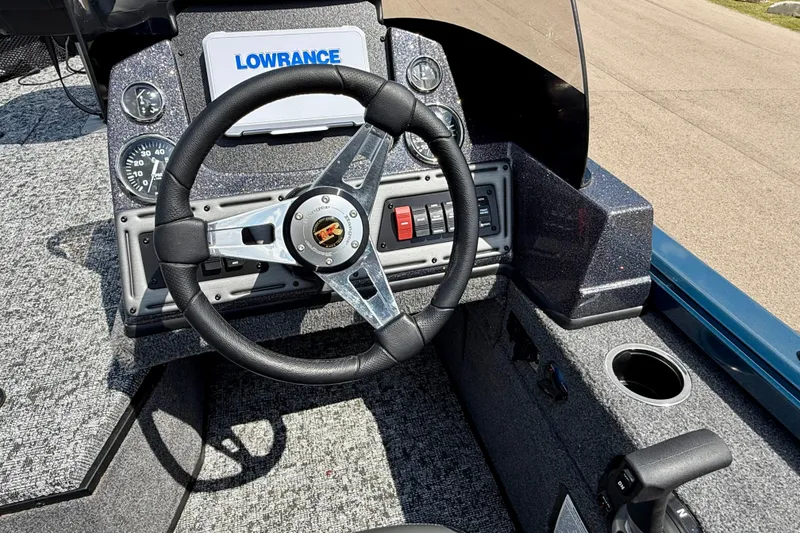 Slide: The Image of 2026 Ranger VS1682SC Angler boat dashboard with steering wheel and Lowrance display. - 9