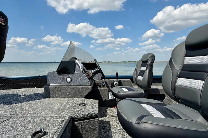 Slide: The Image of 2026 Ranger VS1682SC Angler boat interior with lake view, featuring sleek seating and controls. - 11
