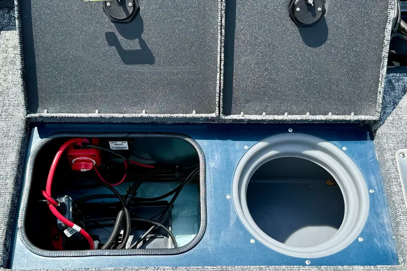 Slide: The Image of 2026 Ranger VS1682SC Angler boat storage compartments with wiring and battery setup. - 7