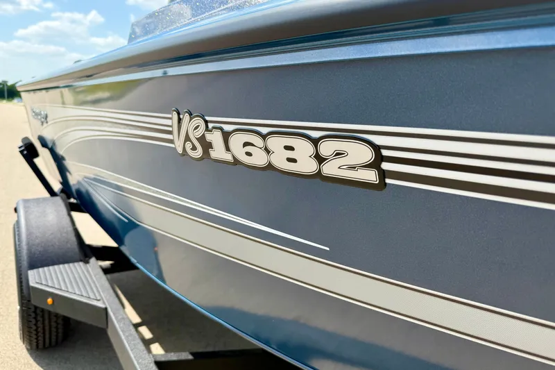 Slide: The Image of 2026 Ranger VS1682SC Angler boat side view with logo and trailer. - 13