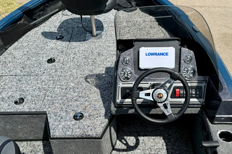 Slide: The Image of 2026 Ranger VS1682SC Angler boat dashboard with Lowrance display and steering wheel. - 6