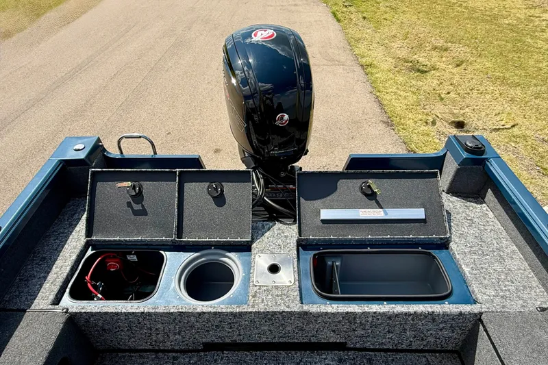 Slide: The Image of 2026 Ranger VS1682SC Angler boat interior with storage compartments and motor. - 8