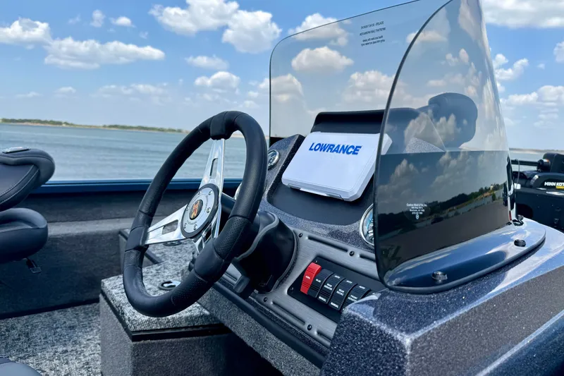 Slide: The Image of 2026 Ranger VS1682SC Angler boat dashboard with steering wheel and Lowrance display. - 4