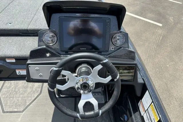 Slide: The Image of 2026 Nitro Z21 XL Pro boat dashboard with steering wheel and Garmin display. - 16