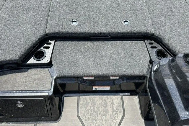 Slide: The Image of The image shows the deck of a Nitro Z21 XL Pro boat with gray carpeting and cup holders. - 14