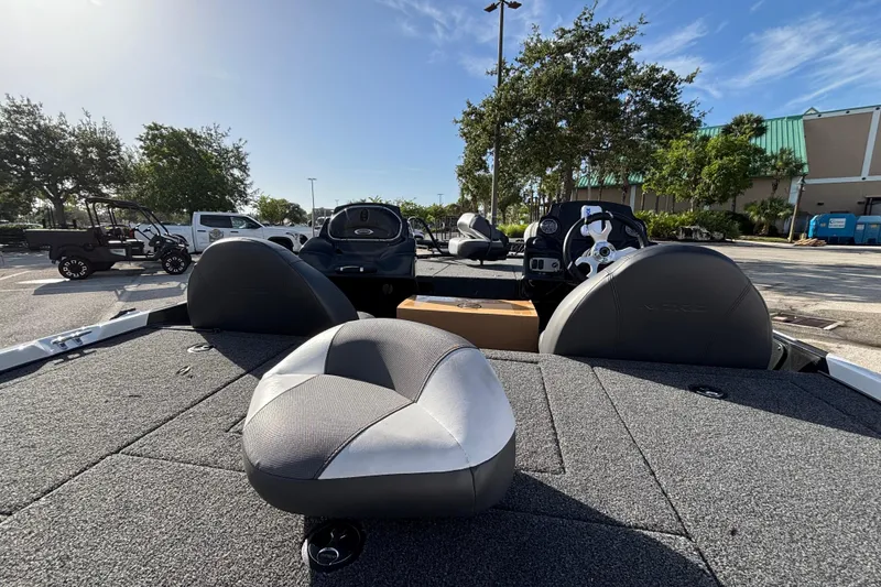 Slide: The Image of 2026 Nitro Z17 boat interior with seating and steering wheel in a sunny outdoor setting. - 96
