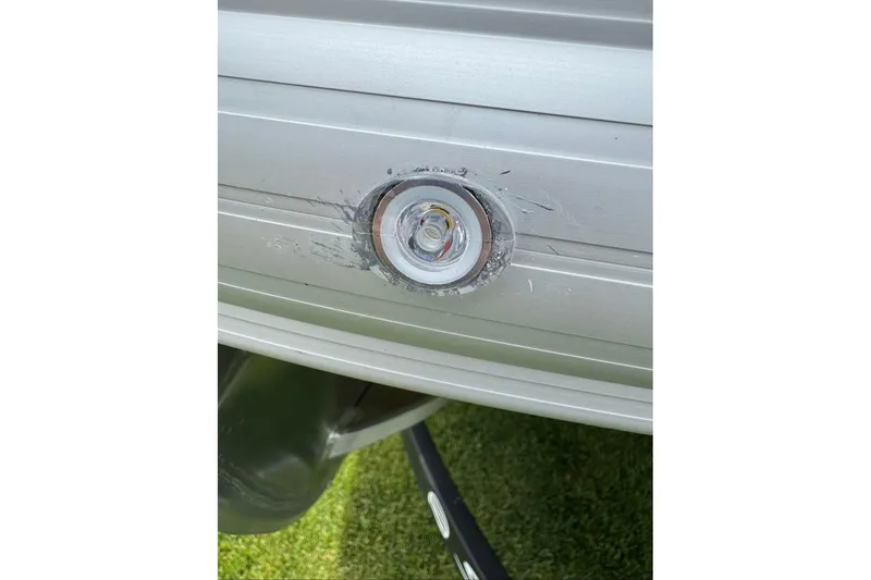 Slide: The Image of Close-up of a 2026 Sun Tracker SportFish 20 DLX boat light fixture. - 102