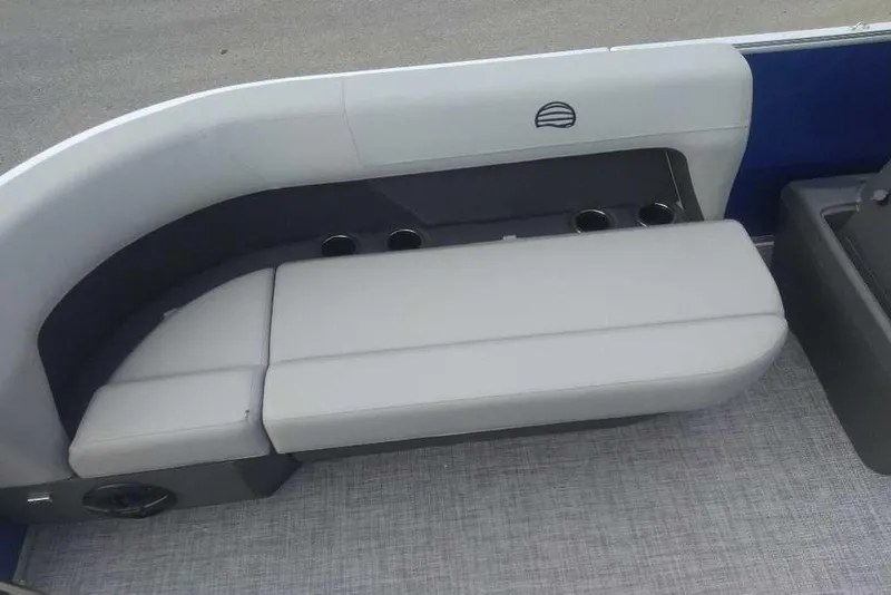 Slide: The Image of 2026 Sun Tracker Party Barge 16 DLX interior seating with cup holders. - 6
