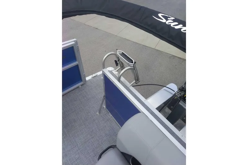 Slide: The Image of 2026 Sun Tracker Party Barge 16 DLX interior with seating and railing details. - 9