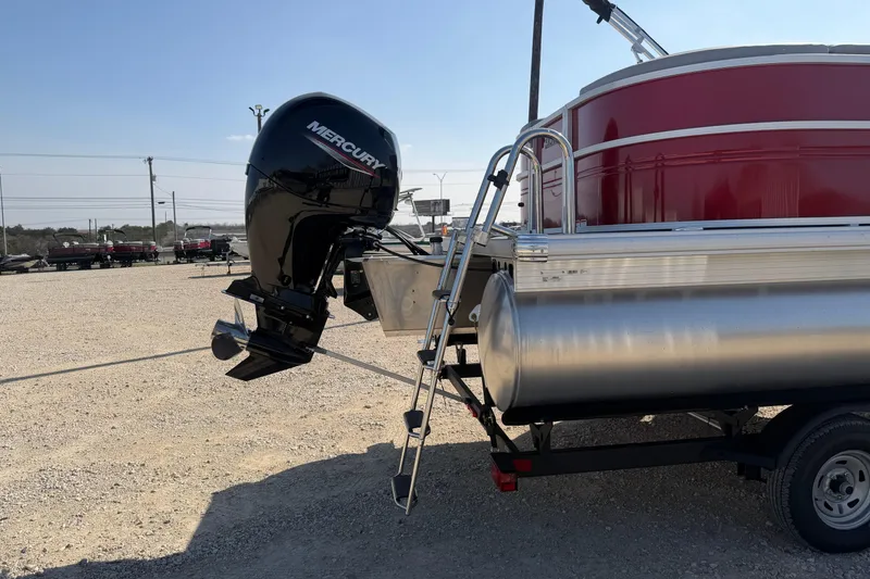 Slide: The Image of 2026 Sun Tracker Party Barge 22 DLX with Mercury outboard motor on trailer. - 3