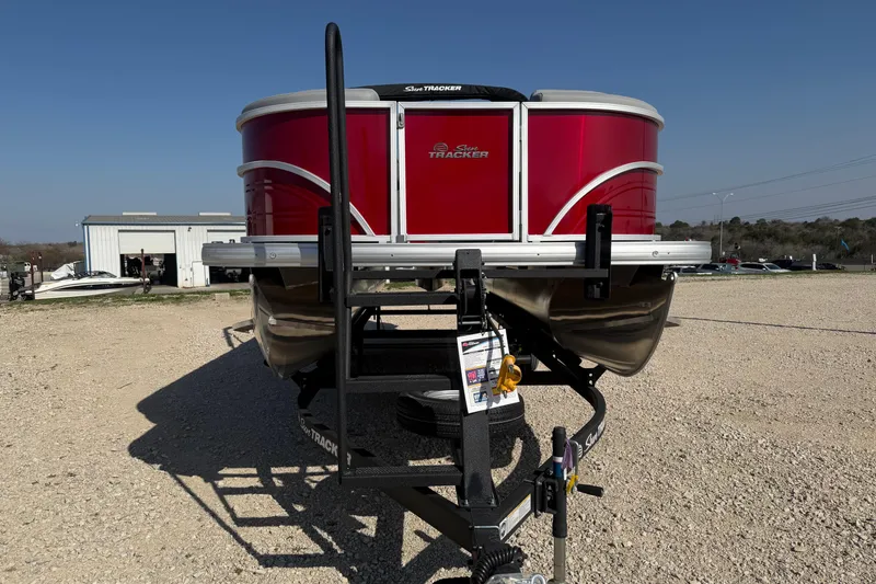 Slide: The Image of 2026 Sun Tracker Party Barge 22 DLX pontoon boat on trailer, sunny day. - 6