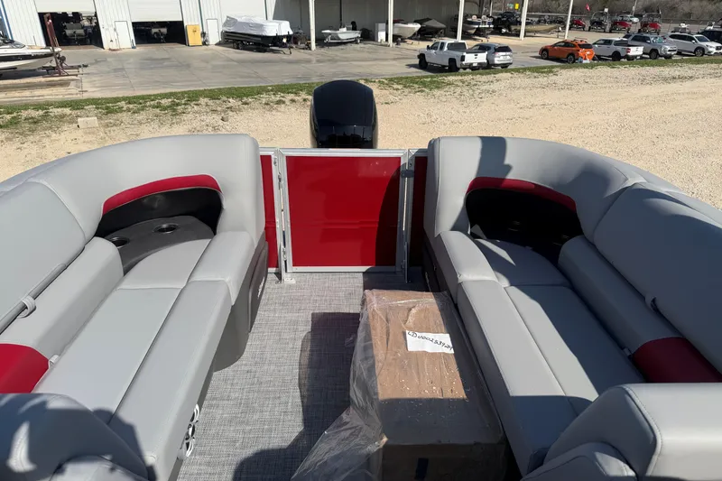 Slide: The Image of 2026 Sun Tracker Party Barge 22 DLX interior with gray and red seating. - 8