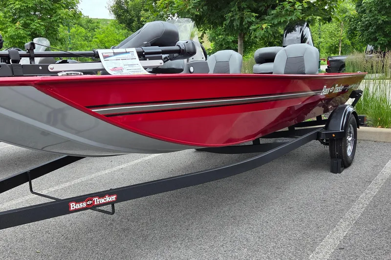 The Image of 2026 Tracker Bass Tracker Classic XL boat on trailer, parked outdoors. - 0