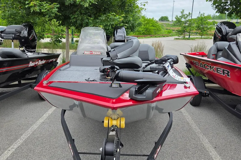 Slide: The Image of 2026 Tracker Bass Tracker Classic XL boat, red, parked outdoors on a trailer. - 2