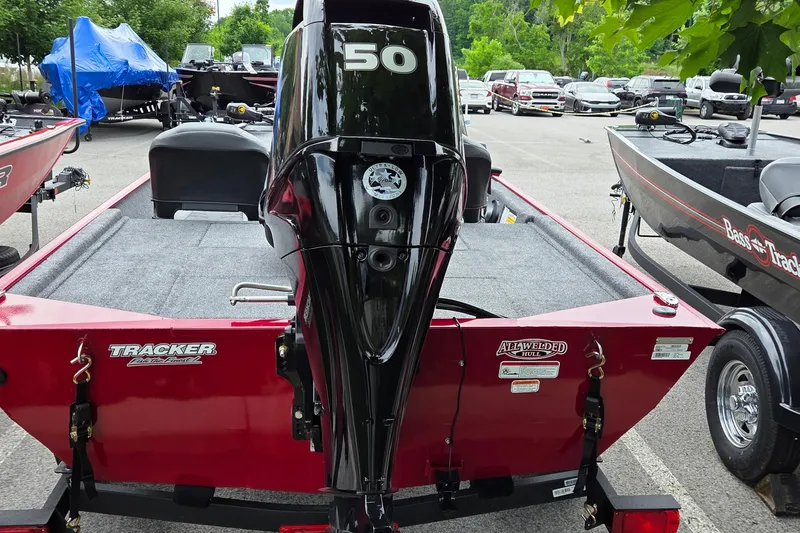 Slide: The Image of 2026 Tracker Bass Tracker Classic XL boat with 50 HP engine in parking lot. - 3