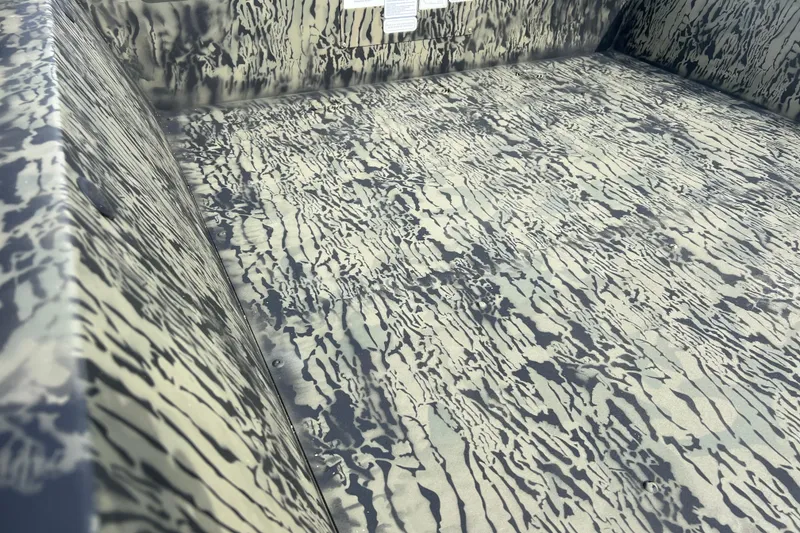 Slide: The Image of Interior view of 2026 Tracker Grizzly 1648 Utility boat with camouflage pattern. - 5