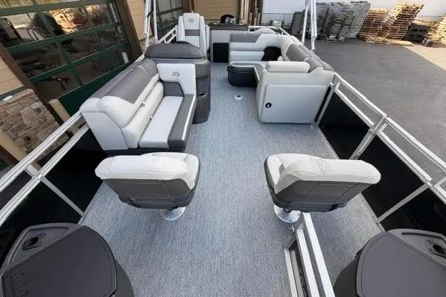 Slide: The Image of 2026 Sun Tracker Fishin' Barge 20 DLX interior with spacious seating and modern design. - 100