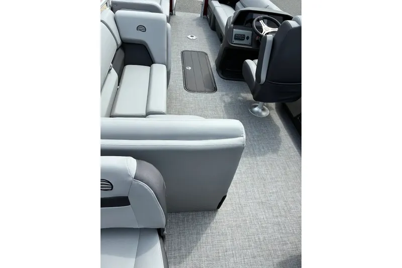 Slide: The Image of 2026 Sun Tracker SportFish 22 XP3 interior with gray seating and modern helm. - 19