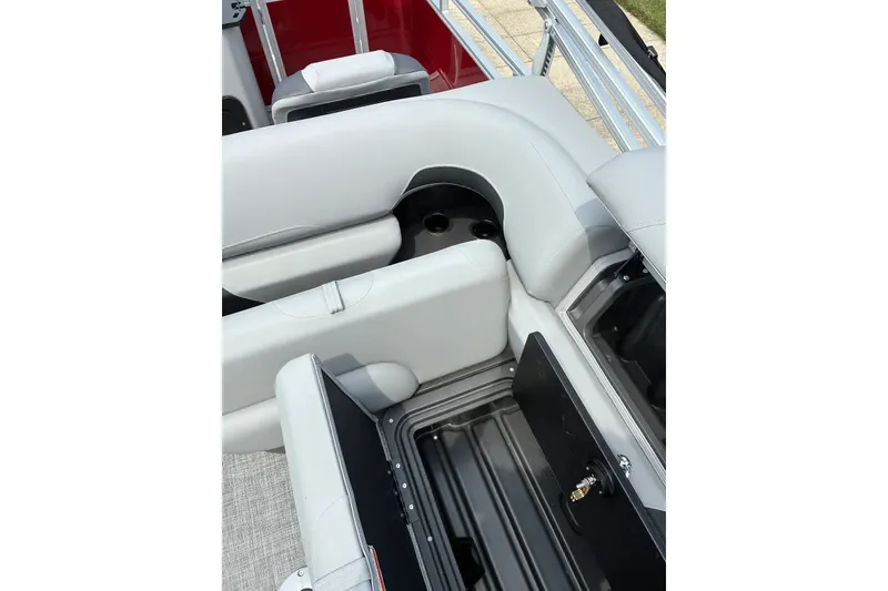 Slide: The Image of 2026 Sun Tracker SportFish 22 XP3 boat interior with storage compartment and seating. - 16