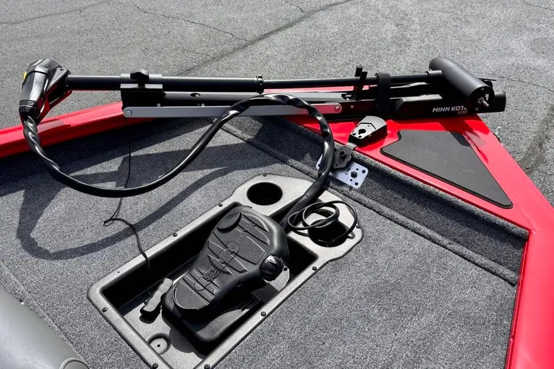 Slide: The Image of 2026 Tracker Pro Team 175 boat with Minn Kota trolling motor on red deck. - 10