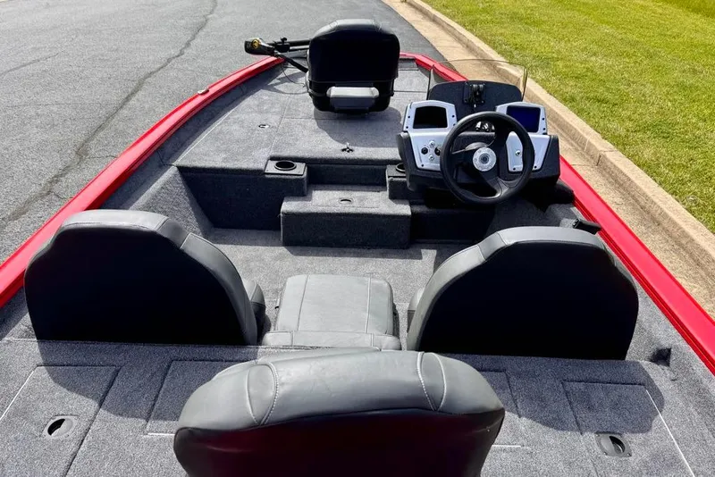 Slide: The Image of 2026 Tracker Pro Team 175 boat interior with steering wheel and seating. - 11
