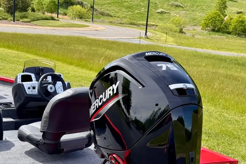 Slide: The Image of 2026 Tracker Pro Team 175 boat with Mercury 75 engine in grassy landscape. - 7