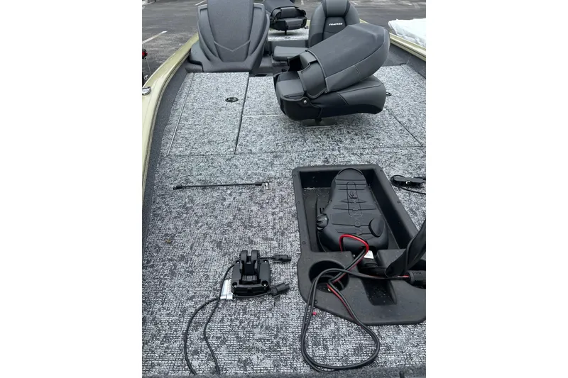 Slide: The Image of 2026 Tracker Pro Team 190 boat interior with seating and fishing equipment. - 4