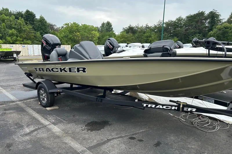 Slide: The Image of 2026 Tracker Pro Team 190 boat on trailer in parking lot. - 2