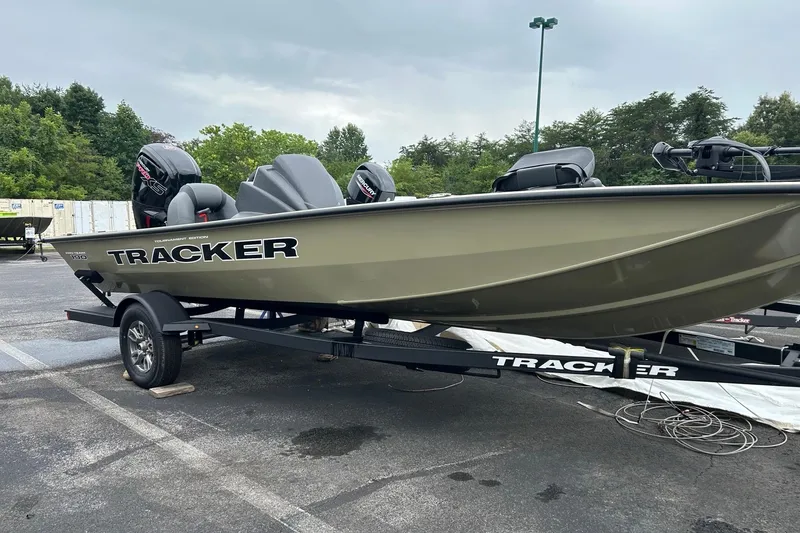 The Image of 2026 Tracker Pro Team 190 boat on trailer in parking lot. - 0