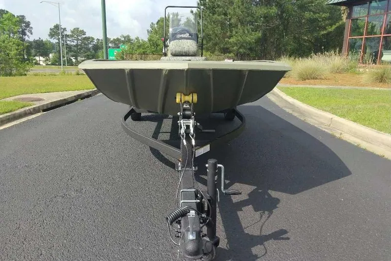 Slide: The Image of 2026 Tracker Grizzly 1860 CC boat on trailer, parked on asphalt road. - 9