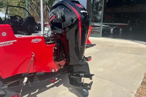 Slide: The Image of 2026 Tracker Pro Guide V-175 Combo boat with powerful outboard motor, parked outdoors. - 15